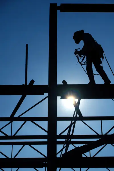 Man Standing On Steel Girder