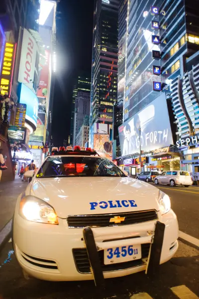 Times Square at night with NYPD patrol car wbp