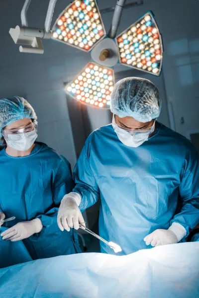 a group of surgeons in a operating room